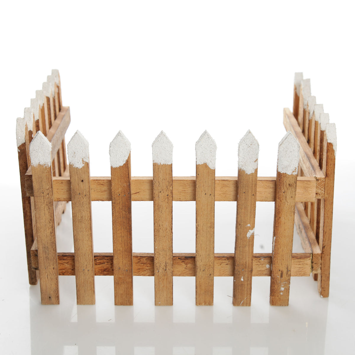 Tall Snow Capped Natural Wooden Picket Fence