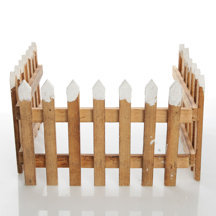 Tall Snow Capped Natural Wooden Picket Fence