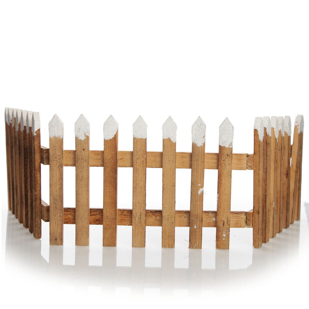 Tall Snow Capped Natural Wooden Picket Fence