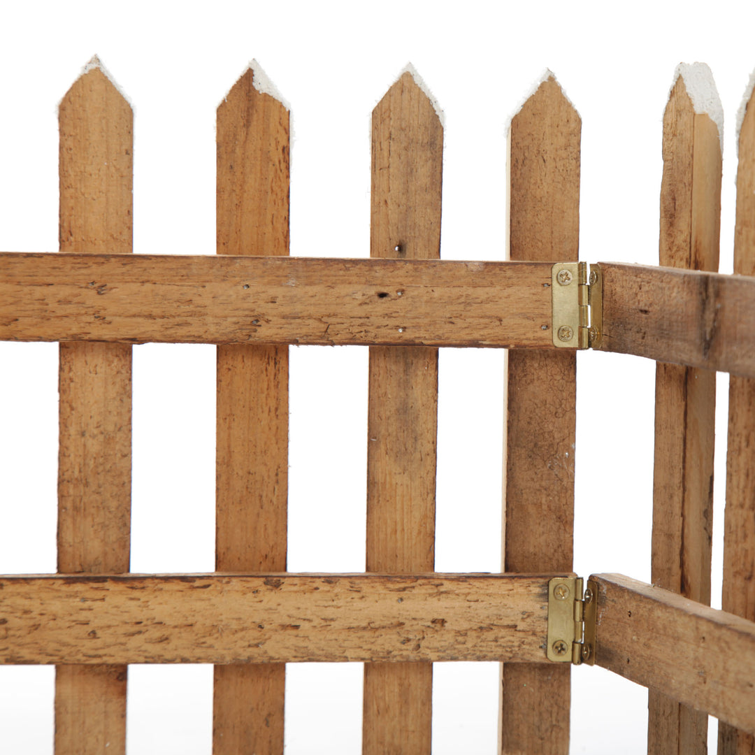 Tall Snow Capped Natural Wooden Picket Fence