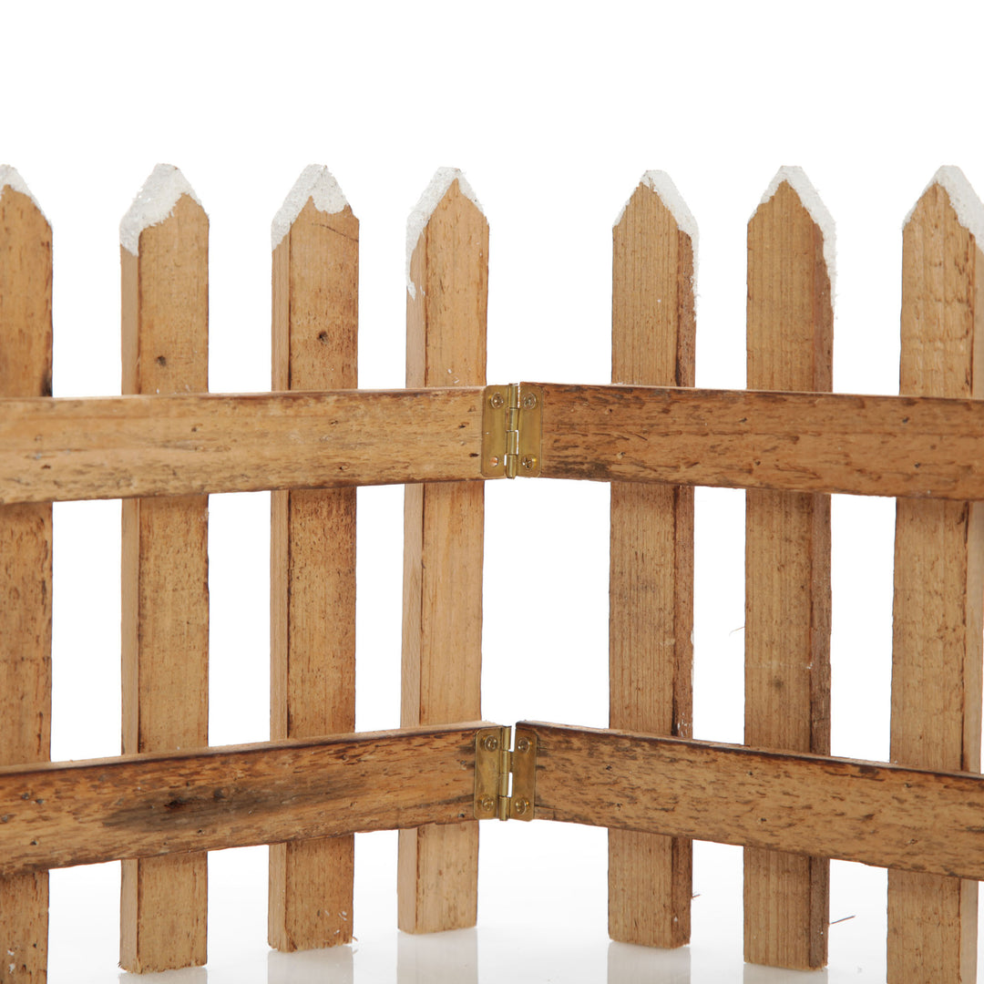 Tall Snow Capped Natural Wooden Picket Fence