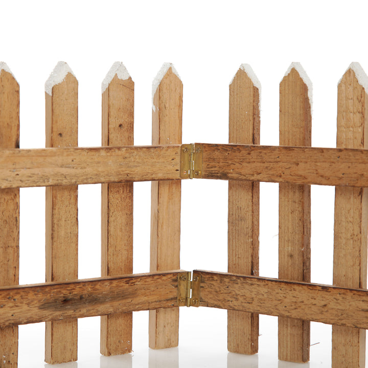 Tall Snow Capped Natural Wooden Picket Fence
