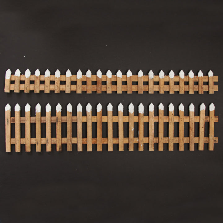 Tall Snow Capped Natural Wooden Picket Fence
