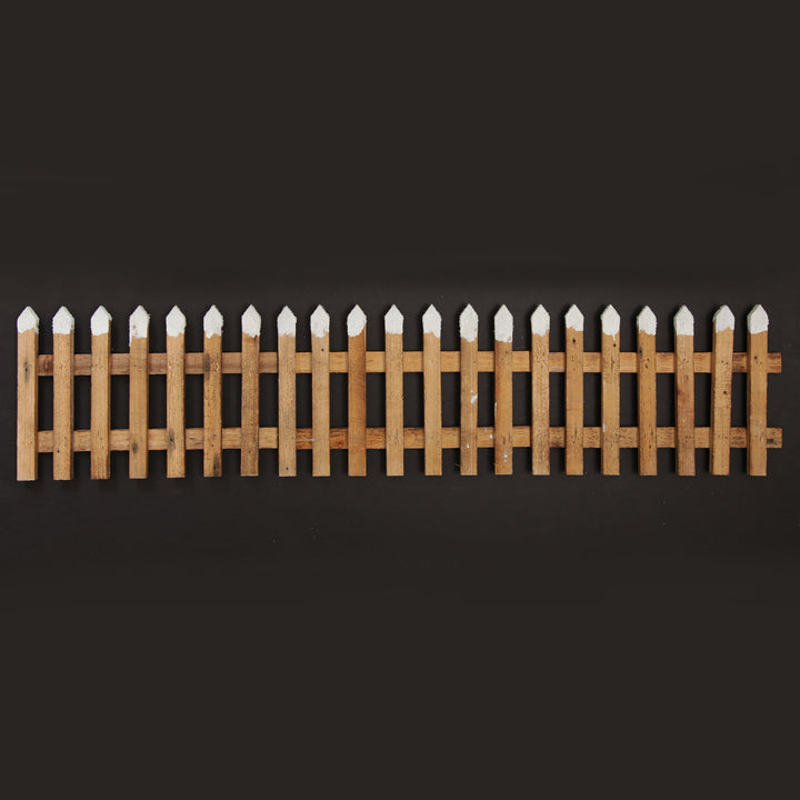 Tall Snow Capped Natural Wooden Picket Fence