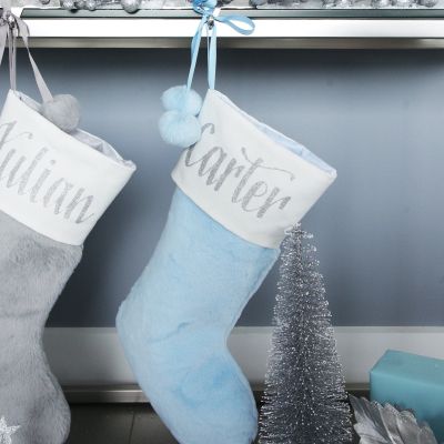 Personalised Blue Fur Christmas Stocking with Pom Poms whole product